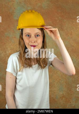 Young woman working in construction industry wearing a protective helmet Stock Photo