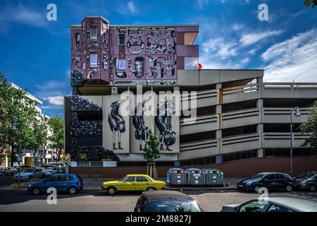 Interesting brutalist building on Kirchbachstraße with lots of graffities in Berlin, Germany Stock Photo