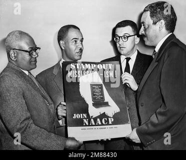 NAACP Members, Henry L. Moon, director of public relations; Roy Wilkins, executive secretary; Herbert Hill, labor secretary, and Thurgood Marshall, special counsel, holding poster against racial bias in Mississippi, Al Ravenna, New York World-Telegram and the Sun Newspaper Photograph Collection, 1956 Stock Photo