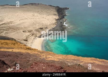 View of La Cocina beach with Montaña Amarilla in the background Stock Photo