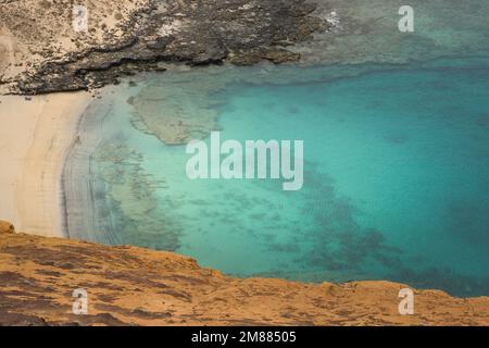 View of La Cocina beach with Montaña Amarilla in the background Stock Photo