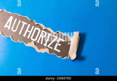 the word authorized is written a white sheet of paper which lies on a delto-white background next to a computer and a calculator. High quality photo Stock Photo