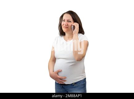 Shot of a painful pregnant woman calling medical assistance with white background Stock Photo