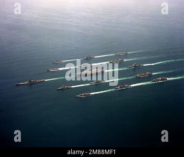 An aerial view of Battle Group Echo in formation. The ships are, from the top, right to left, Row 1: USNS HASSAYAMPA (T-AO-145), USS LEFTWICH (DD-984), USS HOEL (DDG-13); Row 2: USS KANSAS CITY (AOR-3), USS BUNKER HILL (CG-52), USS ROBERT E. PEARY (FF-1073); Row 3: USS LONG BEACH (CGN-9), USS RANGER (CV-61), USS MISSOURI (BB-63); Row 4: USS WICHITA (AOR-1) , USS GRIDLEY (CG-21), USS CURTS (FFG-38); Row 5: USS SHASTA (AE-33), USS JOHN YOUNG (DD-973) and USS BUCHANAN (DDG-14). Country: Northern Arabian Sea Stock Photo