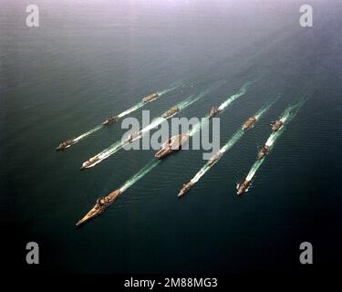 An aerial view of Battle Group Echo in formation. The ships are, from the left, top to bottom, row 1: USNS HASSAYAMPA (T-AO-145), USS LEFTWICH (DD-984), USS HOEL (DDG-13); row 2: USS KANSAS CITY (AOR-3), USS BUNKER HILL (CG-52), USS ROBERT E. PEARY (FF-1073); row 3: USS LONG BEACH (CGN-9), USS RANGER (CV-61), USS MISSOURI (BB-63); row 4: USS WICHITA (AOR-1), USS GRIDLEY (CG-21), USS CURTS (FFG-38); row 5: USS SHASTA (AE-33), USS JOHN YOUNG (DD-973) and USS BUCHANAN (DDG-14). Country: Northern Arabian Sea Stock Photo