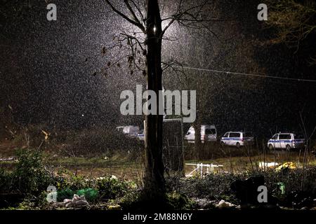 Erkelenz, Germany. 13th Jan, 2023. Rain falls in front of a lighting installation in Lützerath. Credit: David Young/dpa/Alamy Live News Stock Photo