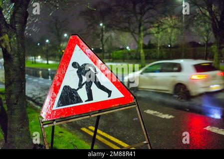 men at work sign roadworks A82 great western road cycle lane closed ahead  sign Stock Photo