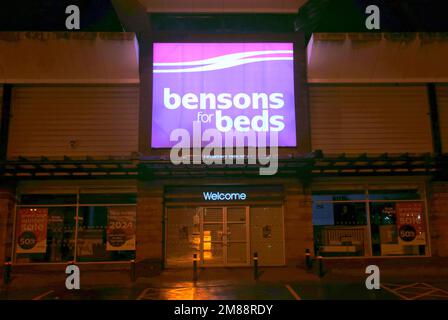 Bensons beds shop sign above front entrance at night with no people Great Western Retail Park1 Allerdyce Rd, Glasgow G15 6RX Stock Photo