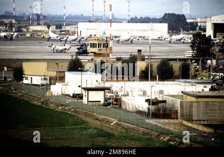 A view from the air traffic control tower of the crash burn, which is the brown building at center. The crash burn has a tower from which members of the air station's crash crew keep a 24-hour watch over the runway and flight line. Base: Naval Air Station, Sigonella State: Sicily Country: Italy (ITA) Stock Photo