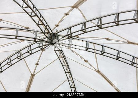 large white canvas tensile roof. architecture background. indoor view from below upwards. Stock Photo