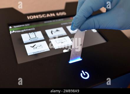 Bruchsal, Germany. 10th Jan, 2023. A swab containing a wipe sample of a letter from prisoners' mail is inserted into an ion scanner at Bruchsal Correctional Institution (JVA). The ion scanner can detect drugs present based on the sample. (to dpa 'Drug scanners' in prisons strike around 150 times') Credit: Uli Deck/dpa/Alamy Live News Stock Photo