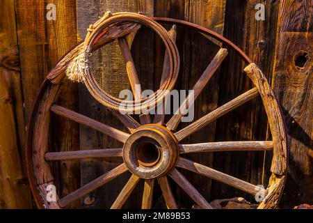 Western Rope And Wooden Wheel Stock Photo