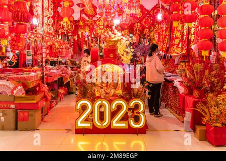 SHEN ZHEN,CHINA - January 9,2023: People buying Tradition decoration of Chinese and good luck symbols for Chinese New Year in Shenzhen Flower Market Stock Photo