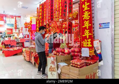 SHEN ZHEN,CHINA - January 9,2023: People buying Tradition decoration of Chinese and good luck symbols for Chinese New Year in Shenzhen Flower Market Stock Photo