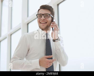 Businessman Making Phone Call In Office Stock Photo