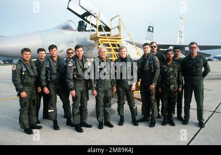 Rep. Bill Chappell of Florida, sixth from left, and Undersecretary of the Air Force James F. McGovern, sixth from right, pose with pilots from the 59th Tactical Fighter Squadron (59th TFS) and ground support personnel in front of an F-15D Eagle aircraft. Base: Andrews Air Force Base State: Maryland (MD) Country: United States Of America (USA) Stock Photo