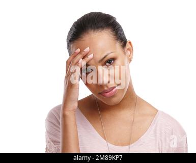 Headache, woman and face with pain, stress and frustrated with crisis and anxiety isolated on white background. Mental health, depression and Stock Photo