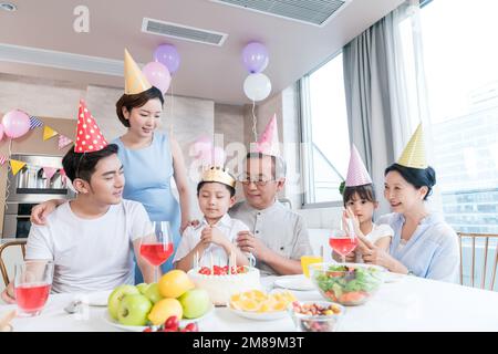 Happy family party to celebrate in the kitchen Stock Photo