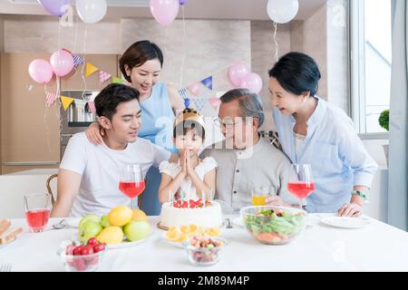 Happy family party to celebrate in the kitchen Stock Photo