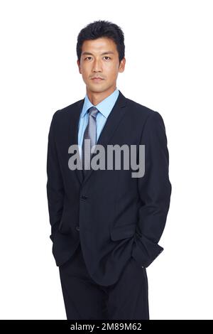 Asian businessman, hands and pocket standing in confidence against a white studio background. Portrait of a isolated confident young business man with Stock Photo