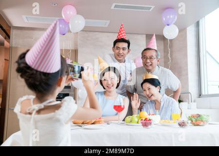 Happy family party to celebrate in the kitchen Stock Photo