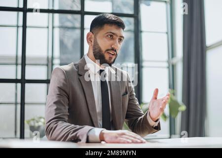 two professional businessmen discussing and using desktop computer in office Stock Photo