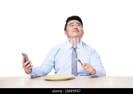 Fat people see mobile phone when you eat Stock Photo