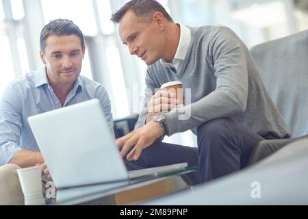 Negotiation meeting, businessman or clients on laptop in company lobby for strategy, planning or feedback. Professional people, financial advisor or Stock Photo