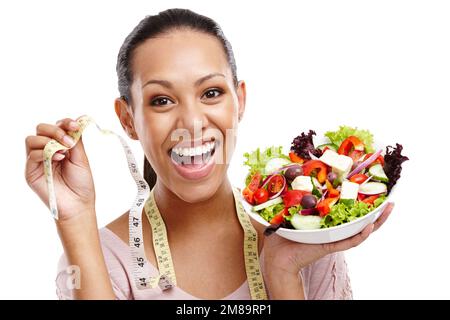 Diet, measuring tape and portrait of woman with salad for health, wellness and lose weight nutrition lifestyle. Smile of happy black woman with Stock Photo