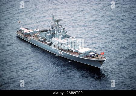 An aerial starboard bow view of the Soviet Krivak I Class guided missile frigate 959 at anchor. Country: Mediterranean Sea (MED) Stock Photo