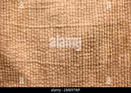 The texture of corduroy in beige brown color Stock Photo