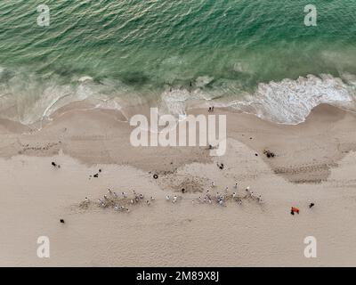 Aerial (drone) view of tug-of-war on Western Australian beach. Stock Photo