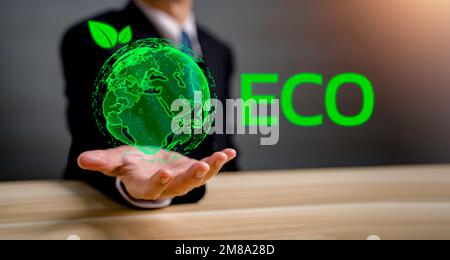 Hand of Businessman holding green world with environment icon, Save world, sustainable environment concept with ECO Typing. Green energy. Renewable en Stock Photo