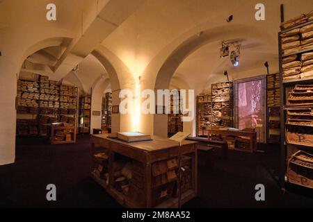 Interior gallery, displaying stacks of old bank ledger, yellowed, sepia record books. At the Museo dell'Archivio Storico del Banco di Napoli, the Bank Stock Photo