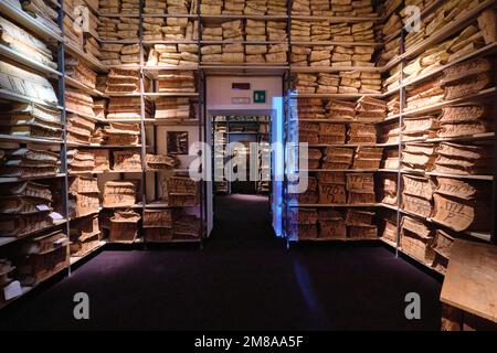 Interior gallery, displaying stacks of old bank ledger, yellowed, sepia record books. At the Museo dell'Archivio Storico del Banco di Napoli, the Bank Stock Photo