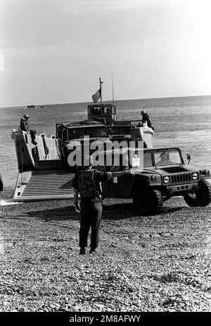 M998 High-Mobility Multipurpose Wheeled Vehicles (HMMWV) are offloaded from a mechanized landing craft (LCM) at Tokra Beach for use during Operation Valiant Blitz '88. Subject Operation/Series: VALIANT BLITZ '88 Country: Republic Of Korea (KOR) Stock Photo
