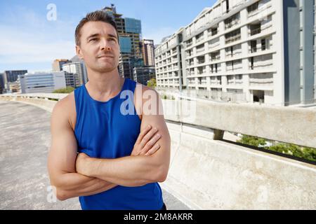Perfect weather for a run. Young man ready to go for a long jog on a sunny day. Stock Photo
