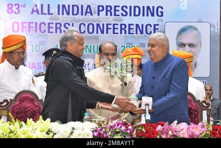 Jaipur, India. 11th Jan, 2023. Rajasthan Chief Minister Ashok Gehlot greets Indian Vice President Jagdeep Dhankhar as Lok Sabha Speaker Om Birla looks on at the 83rd All India Presiding Officers Conference in Jaipur. (Photo by Sumit Saraswat/Pacific Press) Credit: Pacific Press Media Production Corp./Alamy Live News Stock Photo