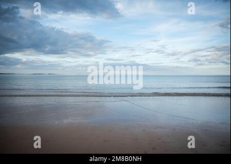 Blue sea and sky at dusk. Tide out Stock Photo