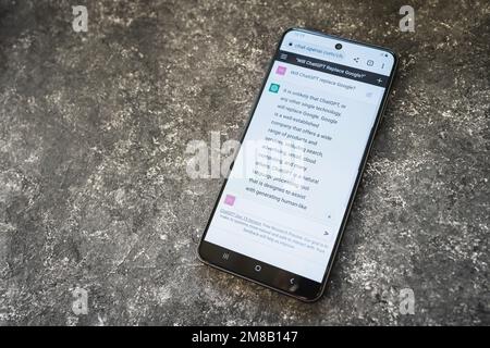 ChatGPT Open AI chat bot on phone screen. Will Chat GPT replace Google prompt response from AI chatbot. Swansea, UK - January 10, 2023. Stock Photo