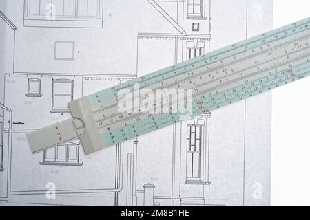 Architects drawings with a slide ruler. An old fashioned way to make ...
