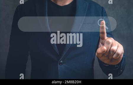 Searching Browsing Internet Data Information Networking Concept, Businessman clicking internet search page on virtual computer touch screen, copy spac Stock Photo