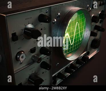 A vintage classic oscilloscope machine on an isolated dark background - 3D render Stock Photo