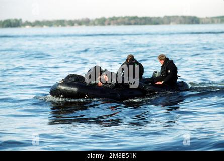 An Army Special Forces Zodiac raft is loaded into an MH-53J Pave Low ...