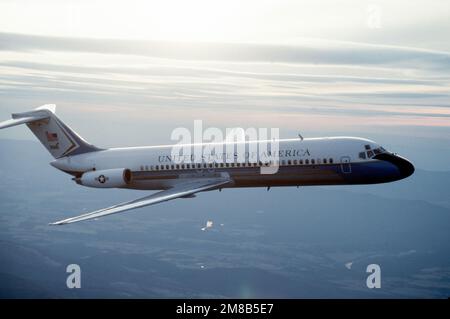 A right side view of a C-9C Nightingale aircraft from the 99th Military Airlift Squadron in flight. Country: Unknown Stock Photo