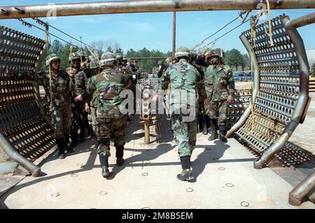 Members of the 82nd Airborne Division prepare for a practice jump from an aircraft mock-up during exercise Sand Eagle '89. Subject Operation/Series: SAND EAGLE '89 Base: Saint Mary'S State: Georgia (GA) Country: United States Of America (USA) Stock Photo