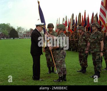 Adm. William Crowe, Jr. passes the ceremonial flag to GEN. Joseph T. Palastra, Jr. as GEN. Colin L. Powell prepares to assume command of Forces Command (FORSCOM). Command SGT. MAJ. Robert F. Beach and Command SGT. MAJ. G.L. Horvath, III participate. Base: Fort Mcpherson State: Georgia (GA) Country: United States Of America (USA) Stock Photo