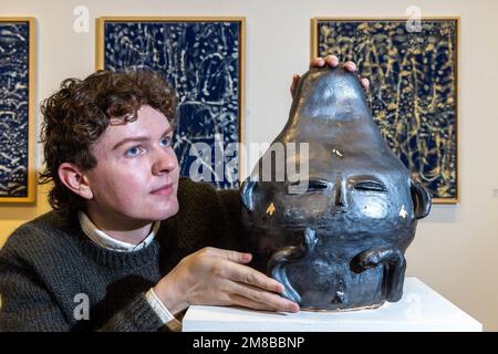 Edinburgh, United Kingdom. 13 January, 2023 Pictured: L to R RSA Staff Member, Tom Hutton with the work Figofago by 2011 award winner, Aleksandra Zawada. The Royal Scottish Academy presents new work from the 2020 and 2021 RSA Barns-Graham Travel Award winners Natasha Jensen and Paige Silverman, alongside sharing current work by past winners and tracing the development of their practice in the intervening years. Alongside is an exhibition of the work of William Littlejohn, In New Light. The exhibitions take place at the RSA in Edinburgh from 14 January until 1 March 2023.  Credit: Rich Dyson/Al Stock Photo