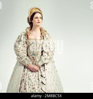 Queen, medieval with renaissance, history and woman with theatre, Shakespeare and drama isolated on white background. Victorian royalty in vintage Stock Photo