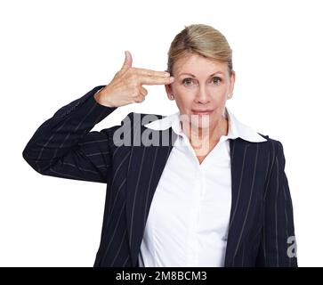 Suicide, hand gun and portrait of senior woman with mental health problem, business depression crisis and job mistake stress. Burnout, career anxiety Stock Photo